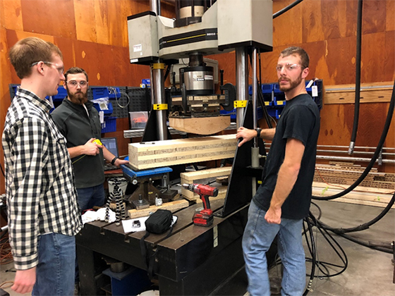 Students learning at a press