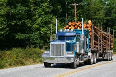 A truck hauling timber