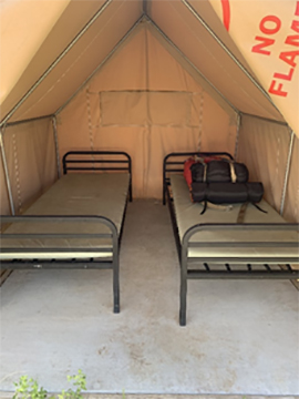 image of 2 cots inside a tent