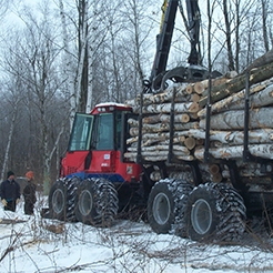 logging tractor pulling trailer of logs