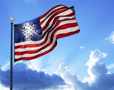 photo of American flag waving in the sky