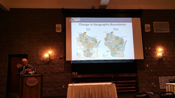 A person giving a presentation on boundaries in Michigan